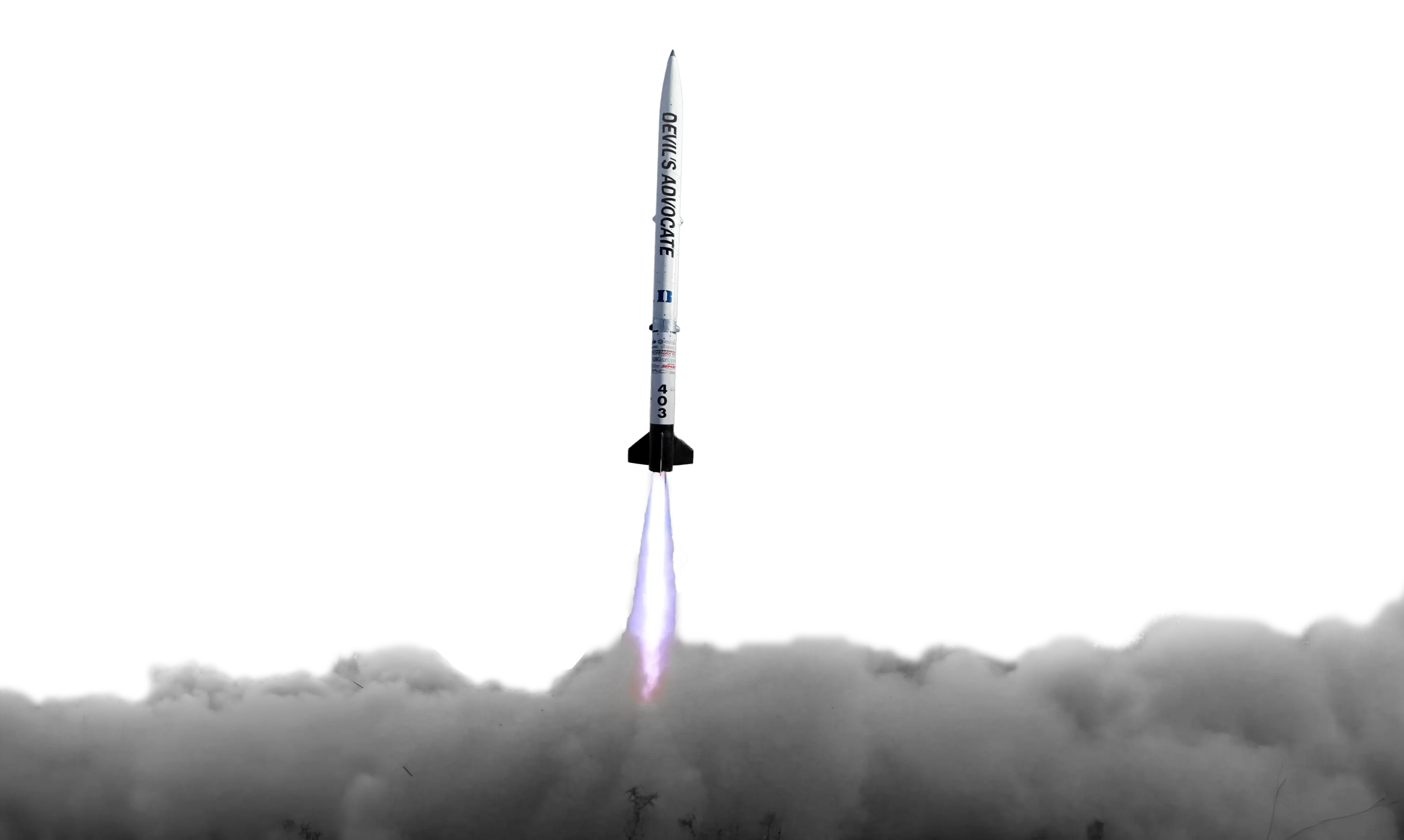 SRAD rocket lifting off through the clouds