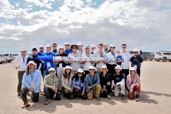 Team photo with the rocket at SAC.