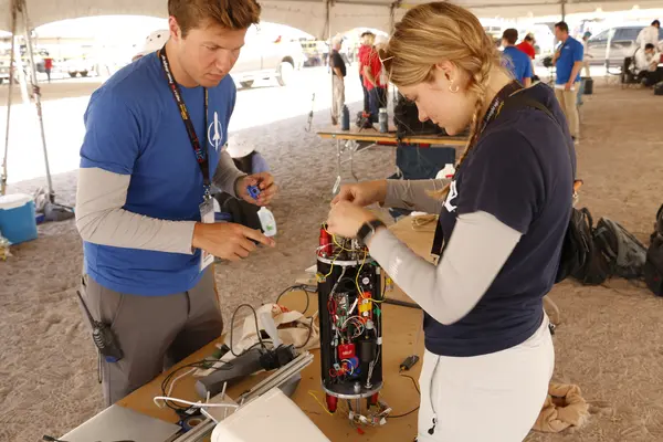 Josh and Allison working on the avionics bay.