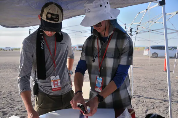 Grant and Sam investigating the nosecone