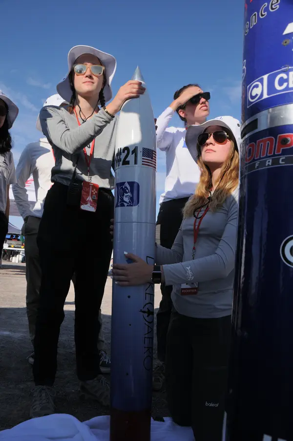 Allison and Megan posing with the rocket.